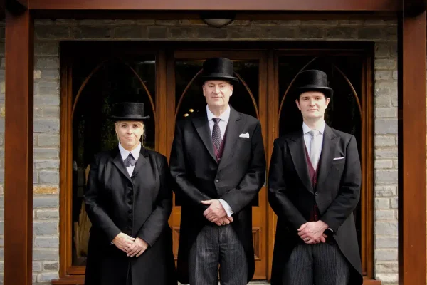 Funeral directors standing outside Willowfields