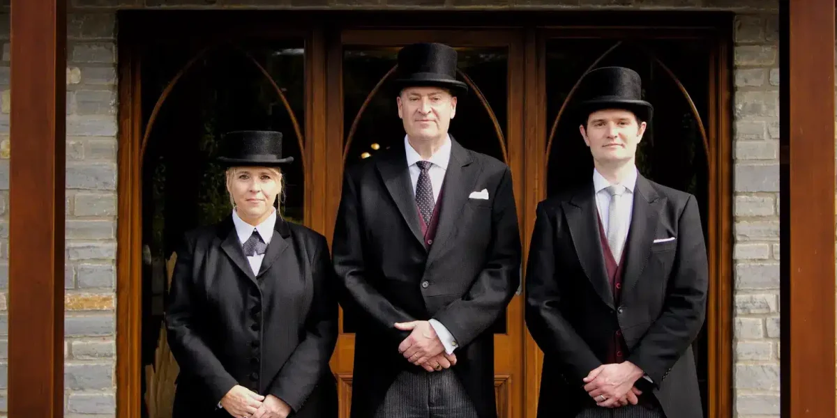 Funeral directors standing outside Willowfields